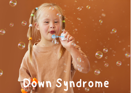 Down syndrome treatment, occupational therapy, Polka dot kids, OT, young girl with Down syndrome blowing bubbles